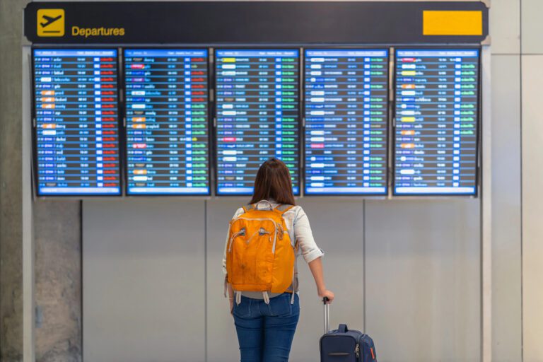 woman in airport traveling with fertility medications